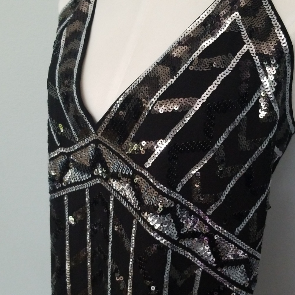 Beautiful black and silver sequence top